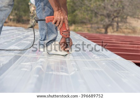 Man working on roof Metal cheese in site construction