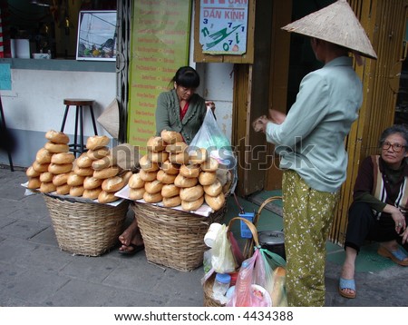 Vietnamese street vendor selling France loaf at street