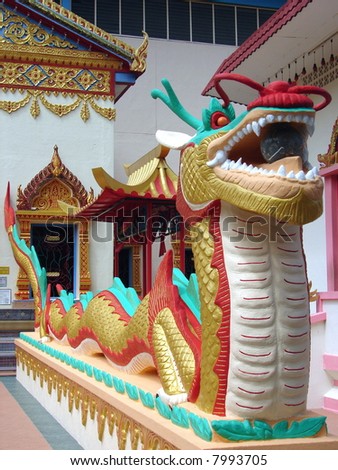 Long Dragon sculpture in front of a oriental temple