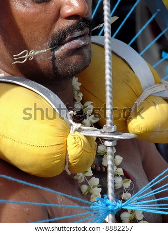 Indian devotee\'s body piercing