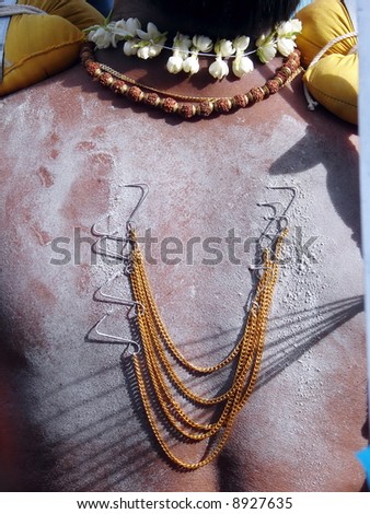 Indian devotee with body piercing