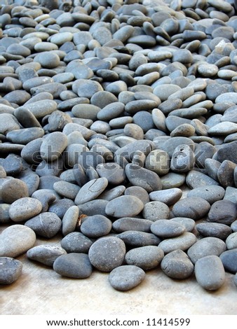 Pool of Pebble stone on cement floor
