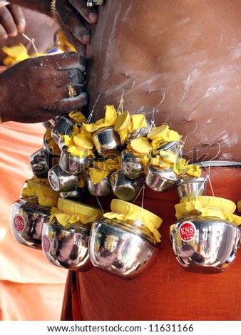 Indian devotee\'s body piercing ceremony