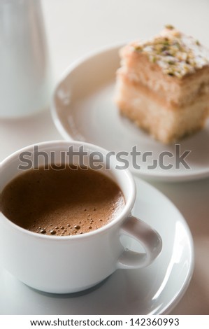 Coffee and a slice of biscuit