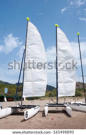 Sailing catamarans on the beach