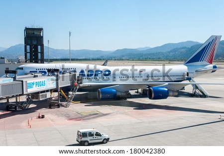 DALAMAN - JUNE 04, 2014: Loading operations in airport Dalaman Turkey,Transaero Tours CENTER - one of the leading company in air cargo in Russia.