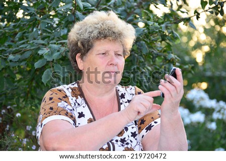 Middleaged woman talks on the mobile phone