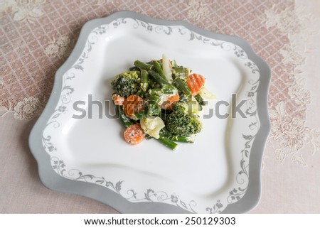 The steamed vegetables with a sour cream