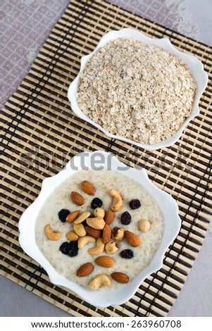 Milk oatmeal with nuts and  a raisins