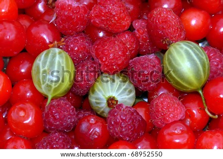 Berry assorted backgrounds. Raspberries, gooseberries, cherries