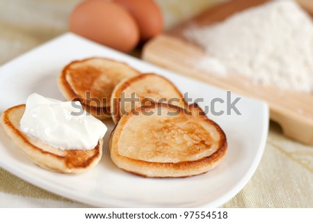 Home pancakes with sour cream, flour and eggs