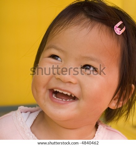 close up of little girl with a big smile
