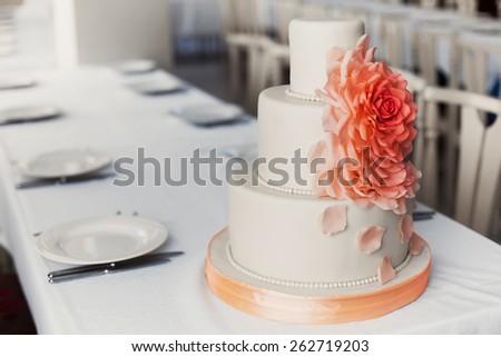 Wedding white cake with mastic and cream orange flower