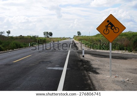 Road in Yucatan Mexico with bicycle sign