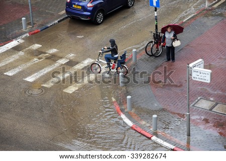 TEL AVIV, ISRAEL - OCTOBER 28, 2015 : View of Ben Yehuda Street on a raining day in Tel Aviv at October 28,2015.Ben Yehuda street is parallel to Dizengoff and to the  seashore.