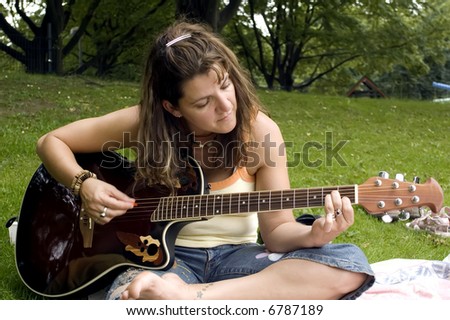 Hippie woman playing the guitar