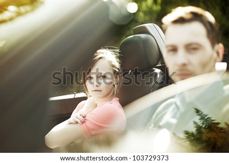 fashion woman and a man in a convertible car