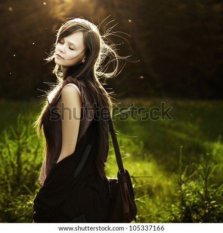 Portrait of romantic fashion woman smile in the woods