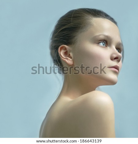 Portrait of a beautiful young girl on an isolated background, beauty and fashion