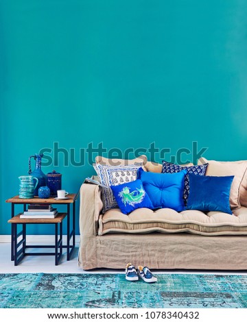 Modern turquoise living room concept. Interior planning decoration with furniture table sofa and lamp.