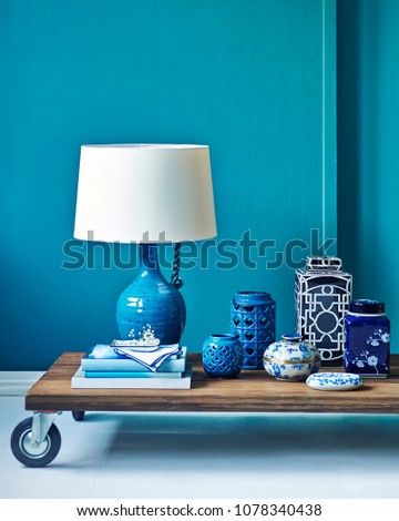 Modern turquoise living room concept. Interior planning decoration with furniture table sofa and lamp.