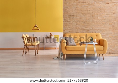 Modern yellow detail living room concept two side room with yellow wall and brick wall decoration.