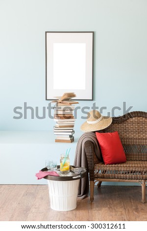 blue wall interior style with wicker sofa