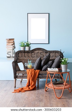 blue wall interior concept and wicker furniture