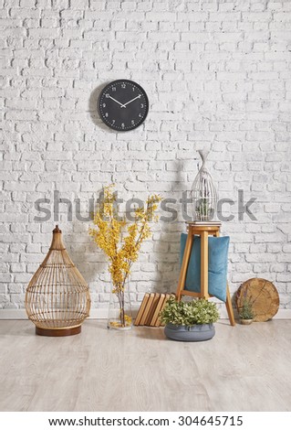 yellow flower and brick wall decor with wooden floor and clock