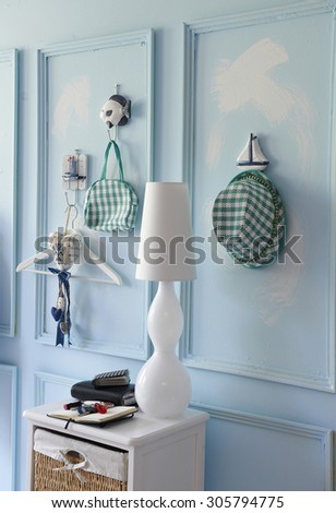 blue wall interior and clothes hangers