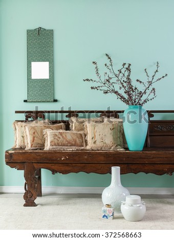 green wall asian interior decor with pillow