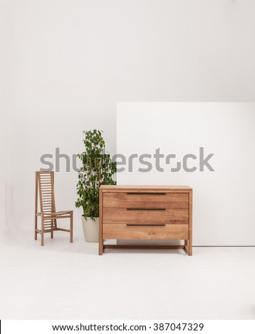 chest of drawers interior decor with wood chair