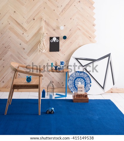 modern interior blue rug and wooden chair with wooden wall decoration