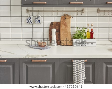 modern kitchen chopping board behind white tile wall interior trend