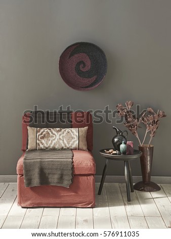pastel tone interior style linen red armchair behind grey wall round frame living room detail