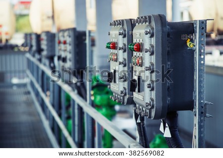 Part of power plant control panel with switches and lamps