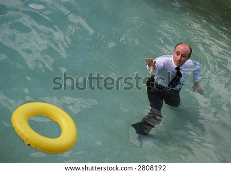 Image of a life saving ring being thrown to a business man.
