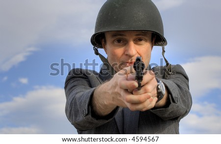 Image of a man in a suit (boss) firing a gun.