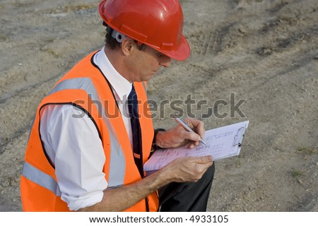 Image of a white collar worker on a new building site