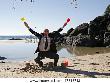 stock-photo-image-of-a-business-man-at-the-beach-throwing-sand-in-the-air-17618743.jpg