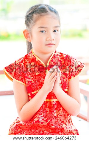 Portrait of oriental girl in Chinese style dress, Thailand.