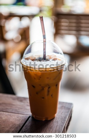 Iced Milk Tea on Wooden Table, Thailand.