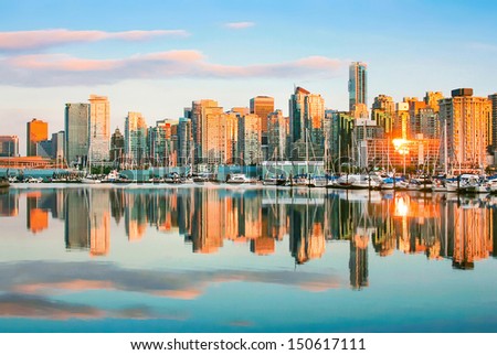 Beautiful view of Vancouver skyline with harbor at sunset, British Columbia, Canada