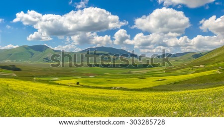 Beautiful summer landscape at Piano Grande (Great Plain) mountain plateau in the Apennine Mountains, Castelluccio di Norcia, Umbria, Italy