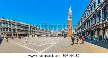 Beautiful panoramic view of historic Piazzetta San Marco with Doge\'s Palace and famous St Mark\'s Campanile, Procuratie and coffee places on a sunny day with blue sky, Venice, Italy
