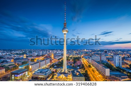 Aerial view of Berlin skyline and dramatic clouds in twilight during blue hour at dusk, Germany