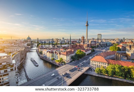Aerial view of Berlin skyline with famous TV tower and Spree river in beautiful evening light at sunset in summer, Germany