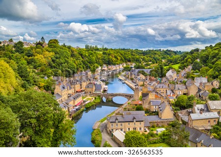 Aerial view of the historic town of Dinan with Rance river with dramatic cloudscape, Cotes-d\'Armor department, Bretagne, northwestern France