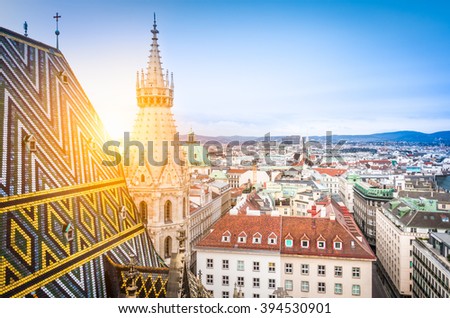 Aerial view over the rooftops of Vienna from the north tower of St. Stephen\'s Cathedral including the cathedral\'s famous ornately patterned, multi colored roof created by 230,000 glazed tiles, Austria