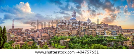 Beautiful panoramic view of the historic city of Siena at sunset with an amazing cloudscape on an idyllic summer evening, Tuscany, Italy